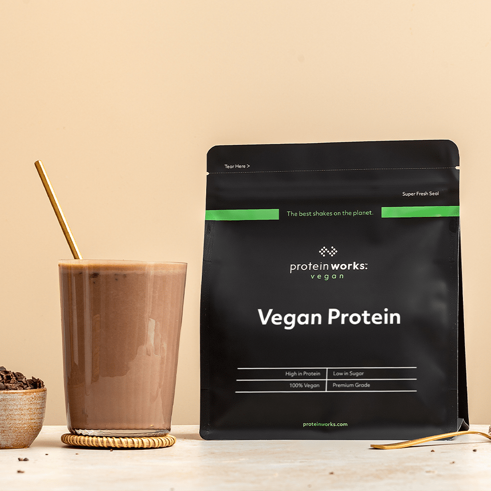 Vegan Protein pouch and a full glass
