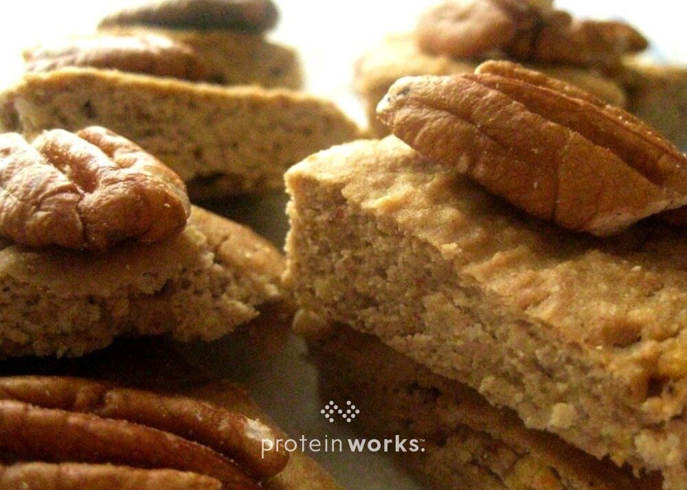 Protein Packed Banana Coconut Orange Blondies with Macadamia & Pecans