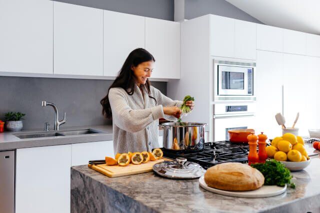 Woman cooking in kitchen