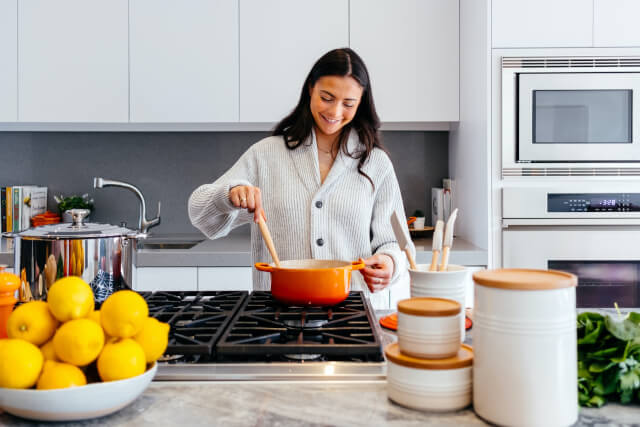 Woman cooking in kitchen