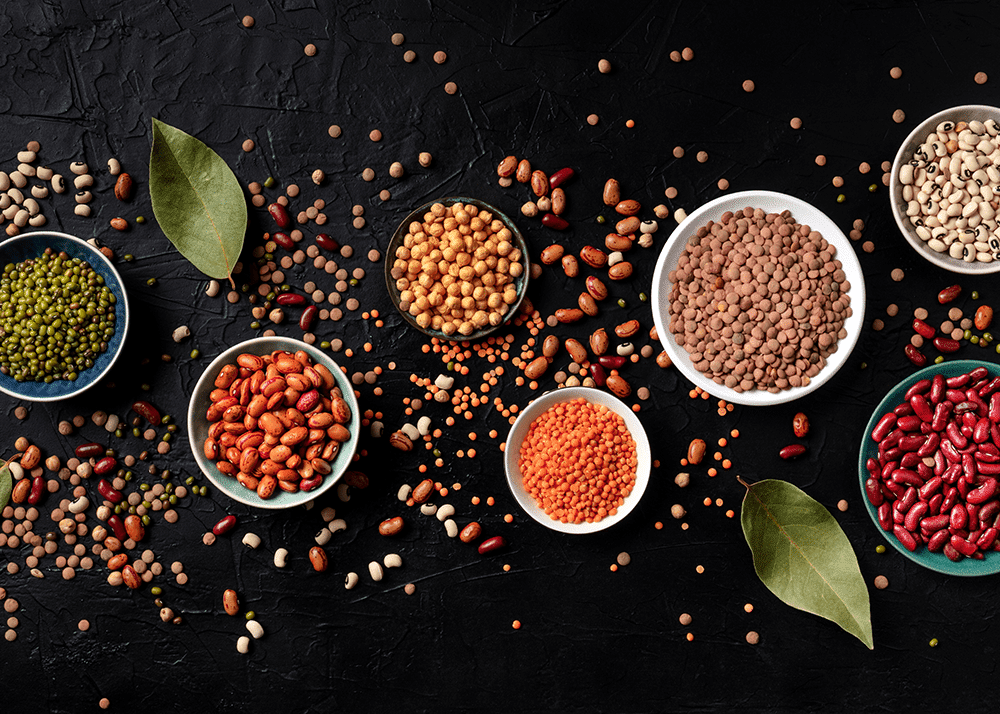 Selection of nuts and beans on a dark background