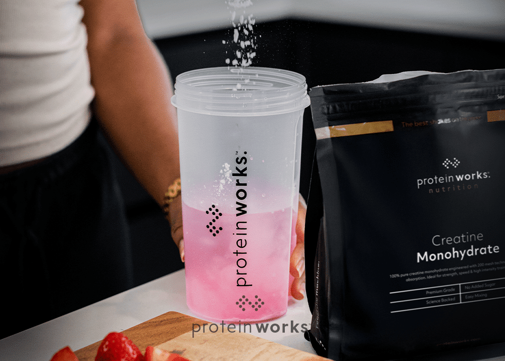 Creatine Monohydrate being poured into a shaker